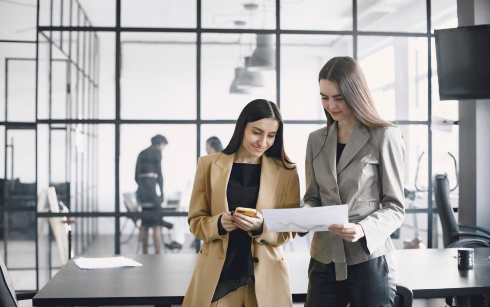 Finance team reviewing prioritized data integration points on a workflow diagram